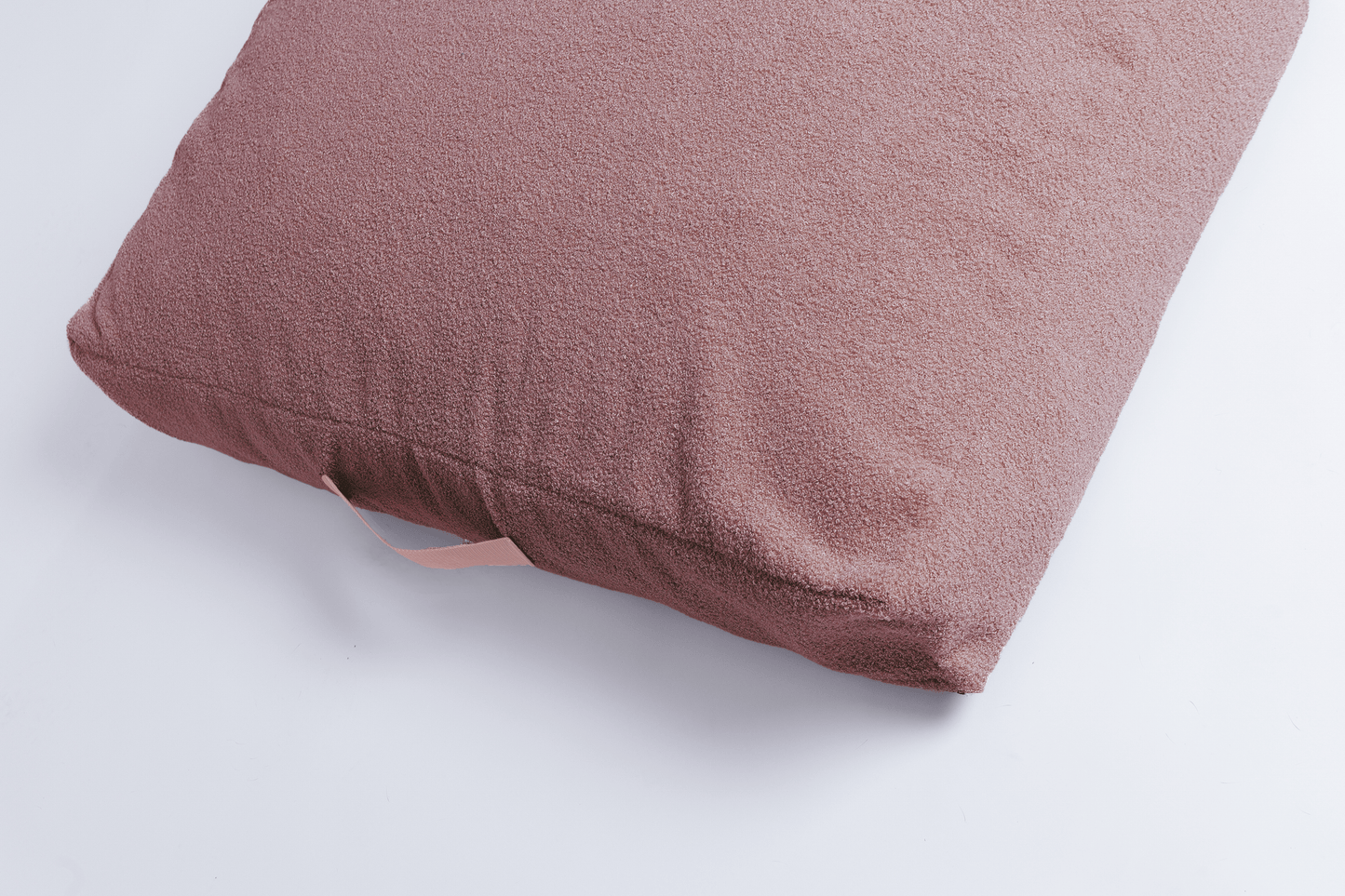 orthopädisches hundebett in rosa Teddyfell von der oben mit Haltegriff
